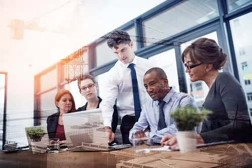 68490b56bbafa406bc48f097 project planning team reviewing responsibilities